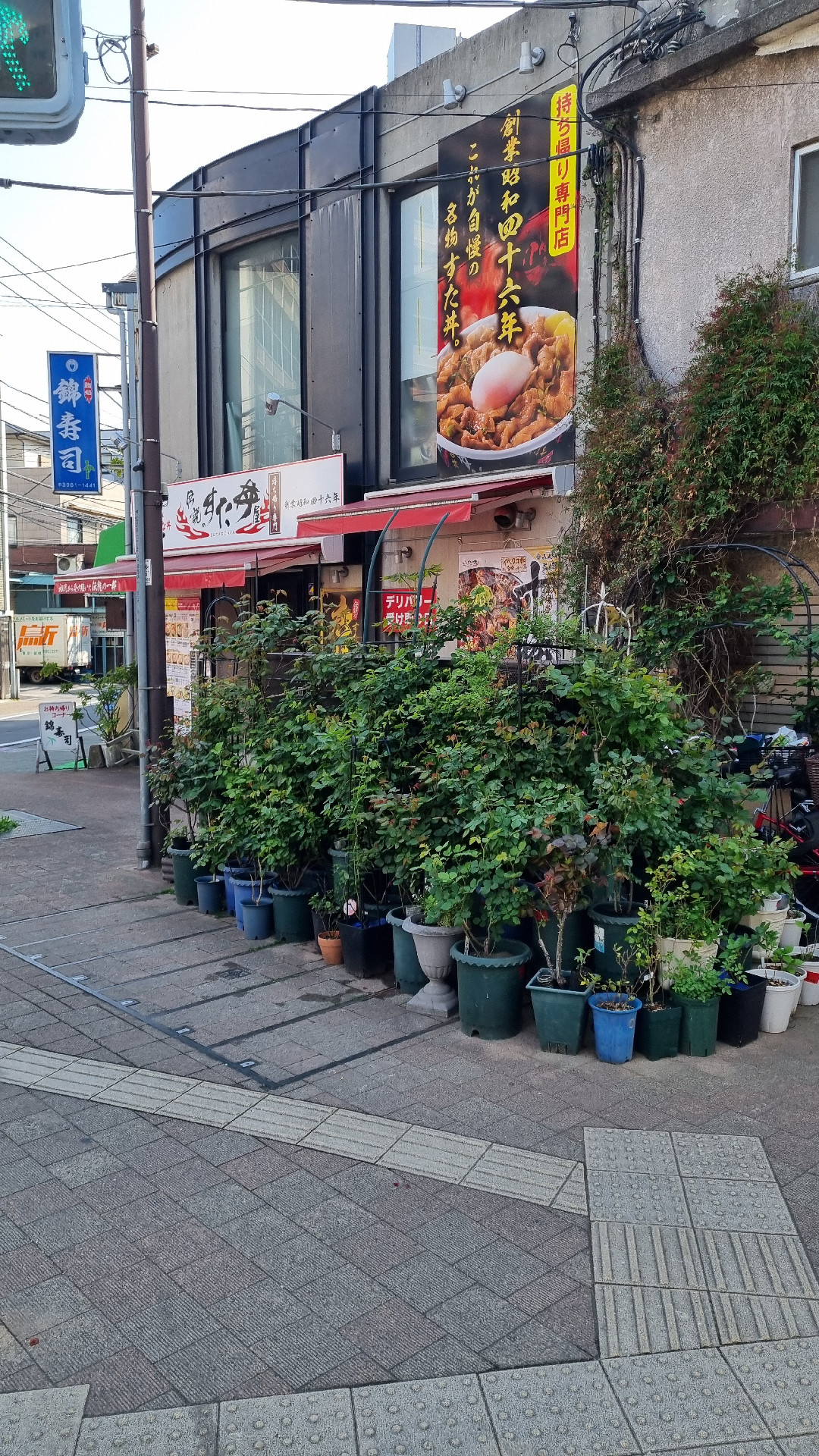 An Ikebukuro store with lots of plant pots in front